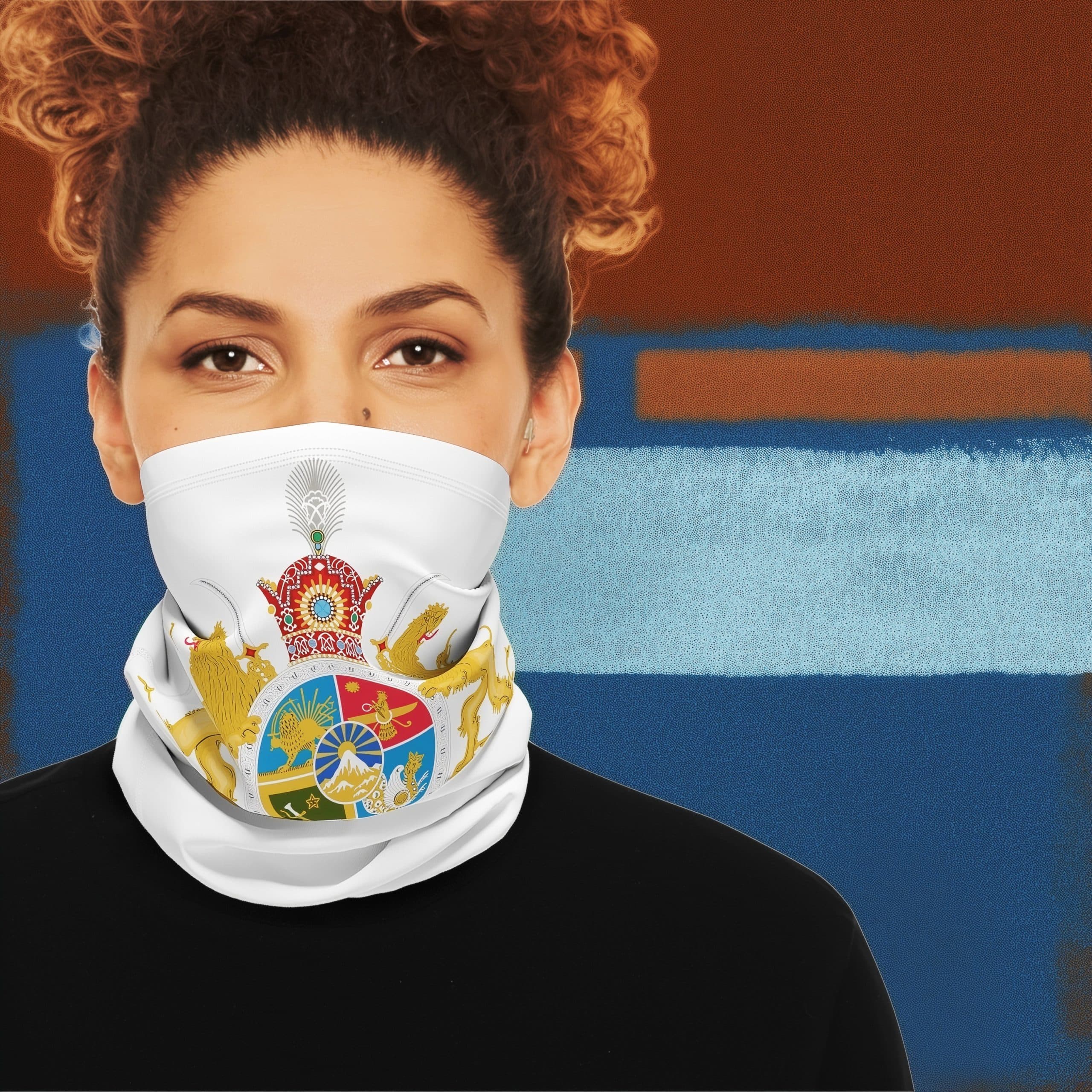 Front-facing woman wearing white neck gaiter featuring a detailed multicolor crest design against a blue and rust textured background.